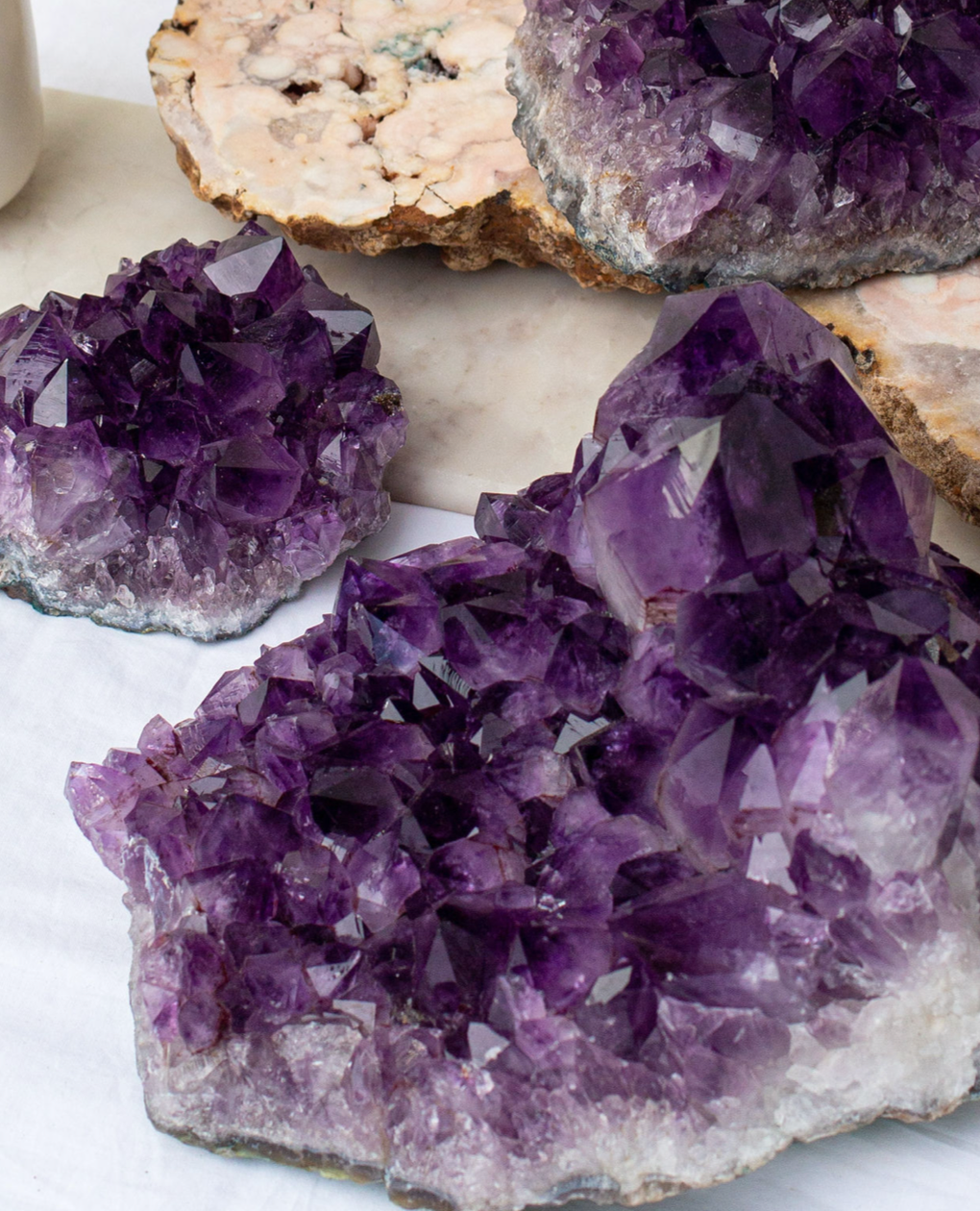 Above, a collection of raw amethyst crystals ethically sourced from Brazil for JIA JIA jewelry pieces